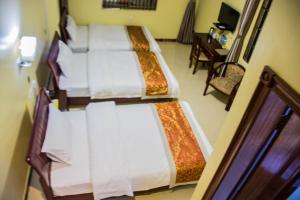 Letto o letti in una camera di Hong Kong Hotel