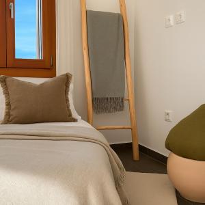 Ένα ή περισσότερα κρεβάτια σε δωμάτιο στο Epidavros View Villas