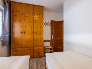 Posteľ alebo postele v izbe v ubytovaní Apartment Cesa Micheluzzi - CZI712 by Interhome
