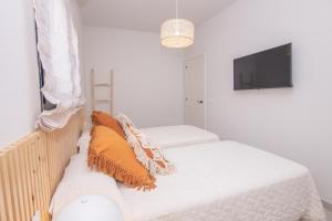 Łóżko lub łóżka w pokoju w obiekcie Villa Eden Beachfront Corralejo By Holidays Home
