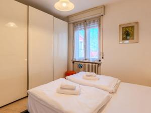 Ένα ή περισσότερα κρεβάτια σε δωμάτιο στο Apartment Claudia by Interhome