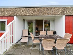 a table and chairs sitting on a patio at Apartment Markus - 300m from the sea by Interhome in Allinge