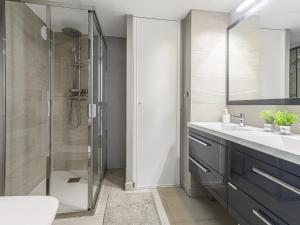 a bathroom with a shower and a sink and a toilet at Apartment Prestige view by Interhome in Èze