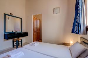 Postel nebo postele na pokoji v ubytování Crete Essence Villas - Lagkada