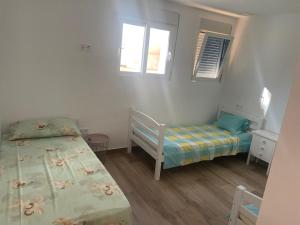 Postel nebo postele na pokoji v ubytování Ferienwohnung Benidorm
