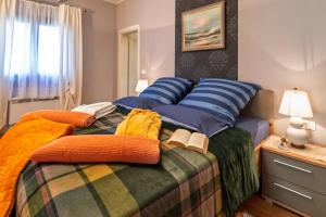 a bedroom with a bed with two books on it at Histria Residence in Umag