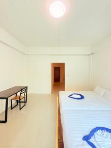 Phak Phing Hostel客房内的一张或多张床位