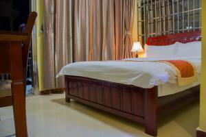 Letto o letti in una camera di Hong Kong Hotel