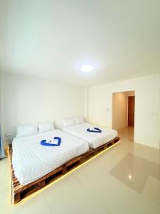 Phak Phing Hostel客房内的一张或多张床位
