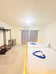 Phak Phing Hostel客房内的一张或多张床位