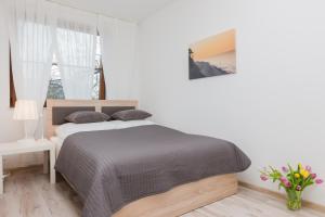 Posteľ alebo postele v izbe v ubytovaní Jantar Apartamenty City Center