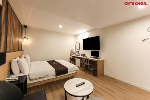 TV a/nebo společenská místnost v ubytování Forest 701 Hotel
