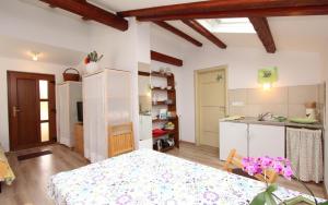 a kitchen and dining room with a table in a room at Studio Rovinj Home in Rovinj
