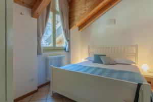 Кровать или кровати в номере Veloccino del Lago
