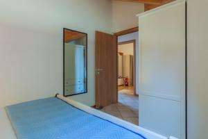 Кровать или кровати в номере Veloccino del Lago
