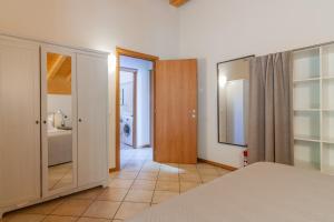 Кровать или кровати в номере Veloccino del Lago