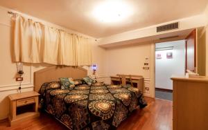 Ένα ή περισσότερα κρεβάτια σε δωμάτιο στο Villa Miramare con Ampia Piscina Riscaldata e Vista Mare