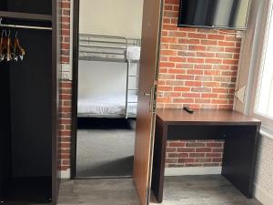 Postel nebo postele na pokoji v ubytování Hotel Au Spatial