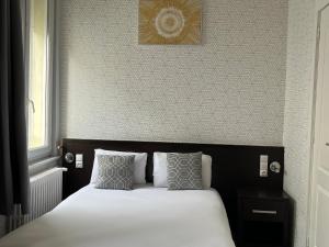 Postel nebo postele na pokoji v ubytování Hotel Au Spatial