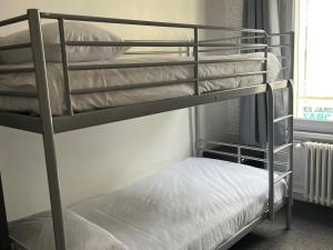 Postel nebo postele na pokoji v ubytování Hotel Au Spatial