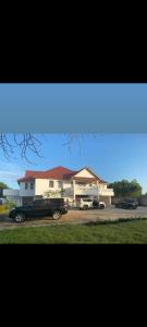a black car parked in front of a house at Villa CasaGrande in Ukunda Airport