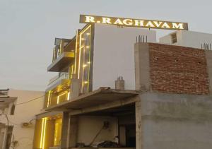 a building with a sign on top of it at Hotel R.Raghavam in Ayodhya