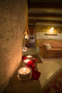 a group of candles sitting on a wall at Il Borghetto Vacanze nei Mulini in Valeggio sul Mincio
