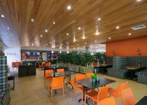 a restaurant with tables and chairs in a room at Fell End in Milnthorpe +45 photos