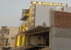 a building with a sign on top of it at Hotel R.Raghavam in Ayodhya