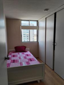 Ένα ή περισσότερα κρεβάτια σε δωμάτιο στο Departamento con bonita vista