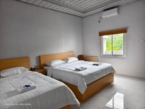 Lombokhouse Mandalika客房内的一张或多张床位