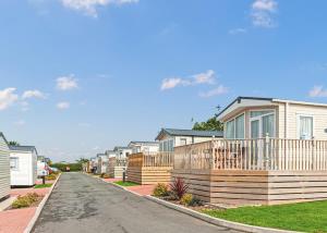 a row of houses on a residential street at Ocean Heights Holiday Park in New Quay