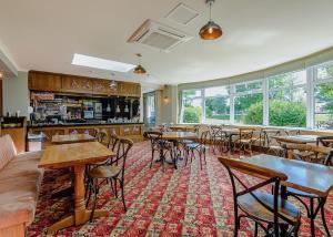 a restaurant with tables and chairs in a room at North Shore Holiday Park in Winthorpe +55 photos