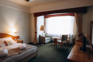 Postel nebo postele na pokoji v ubytování Parkhotel Golf Marianske Lazne