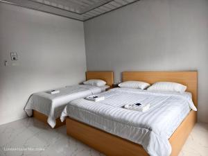Lombokhouse Mandalika客房内的一张或多张床位