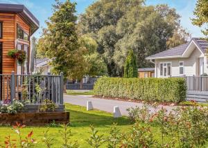 a house in a suburb with a garden at Roydon Marina Village in Roydon
