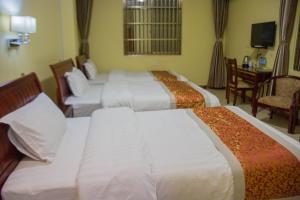 Letto o letti in una camera di Hong Kong Hotel