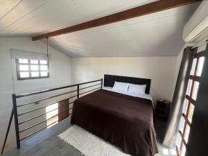 a bedroom with a bed in a room at Chalés Jacumã Paradise in Jacumã