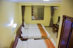Letto o letti in una camera di Hong Kong Hotel