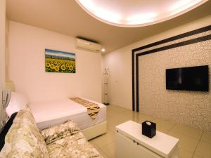 TV a/nebo společenská místnost v ubytování Easy Home Stay