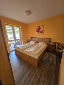 Postel nebo postele na pokoji v ubytování Haus Kim - Apartments