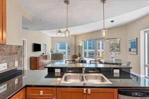 a kitchen with a sink and a counter top at Beautiful Downtown Condo 1 Bed 1 Bath in Orlando