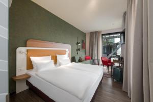 Letto o letti in una camera di Mercure Zürich City