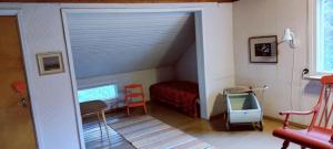 a room with a room with a bed and a window at Spacious Apartment for 8 with Sauna in Sievi