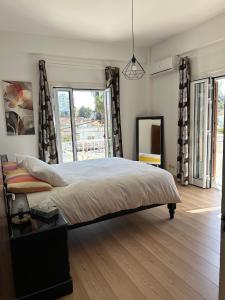 Ένα ή περισσότερα κρεβάτια σε δωμάτιο στο Bougainvillea