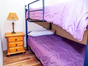 Posteľ alebo postele v izbe v ubytovaní Apartamento