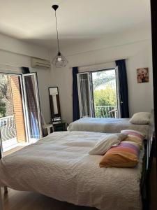 Ένα ή περισσότερα κρεβάτια σε δωμάτιο στο Bougainvillea