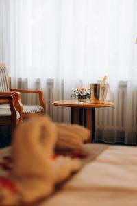 Postel nebo postele na pokoji v ubytování Parkhotel Golf Marianske Lazne