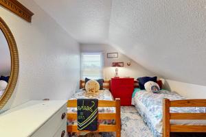 Ένα ή περισσότερα κρεβάτια σε δωμάτιο στο Chinook Cottage
