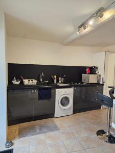 Kuchyň nebo kuchyňský kout v ubytování Appartement de caractère